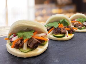 BRISKET BURNT ENDS ASIAN BAO BUNS WITH RADISH SRIRACHA SLAW AND PICKLES